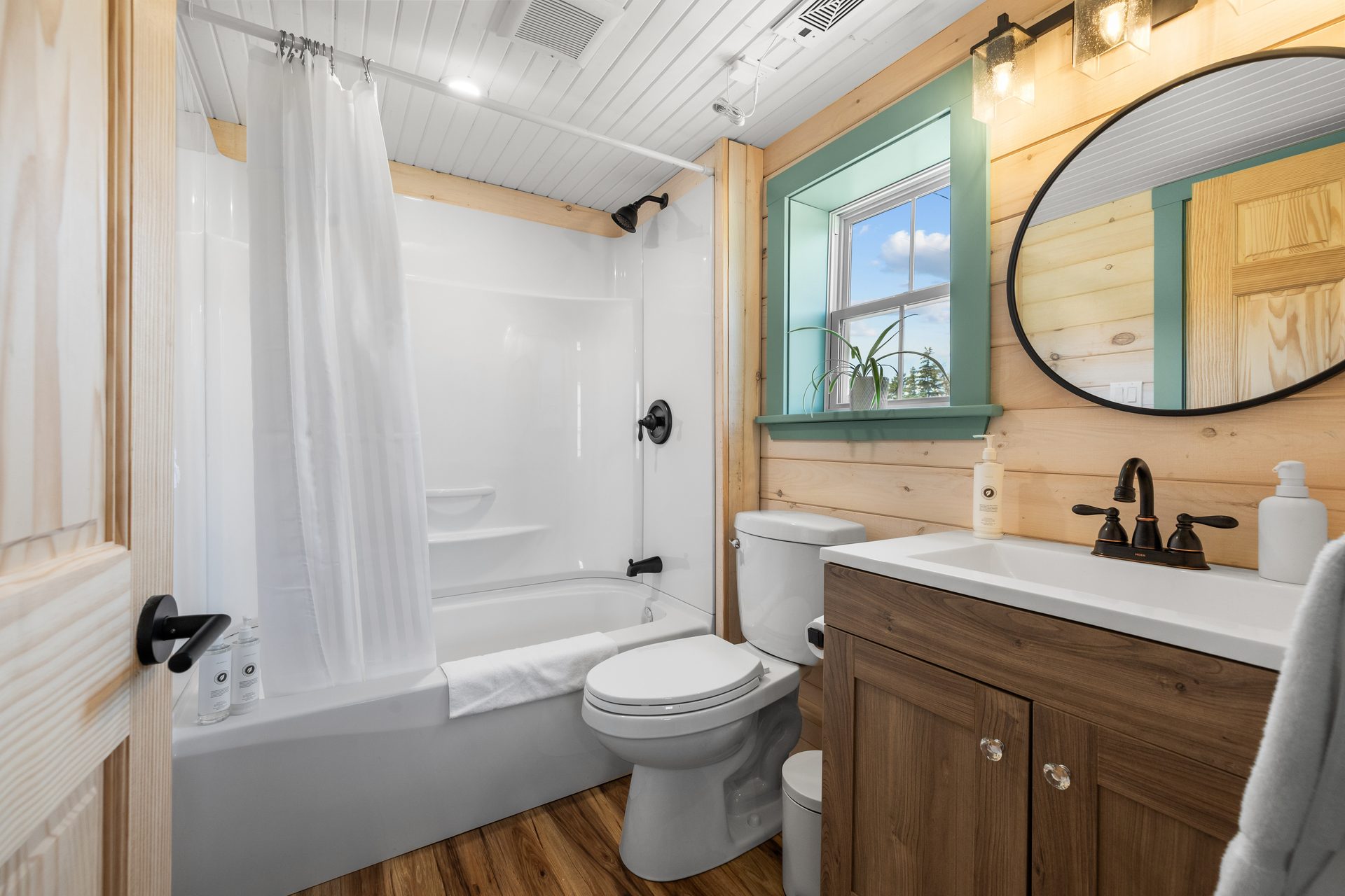 Full bathroom with shower and vanity